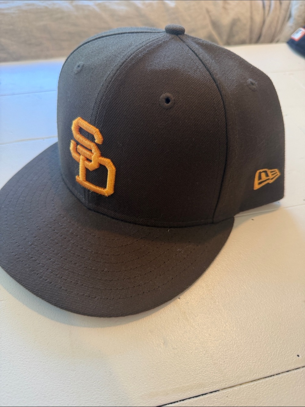 New Era Brown Snapback Hat with Gold Embroidered Logo